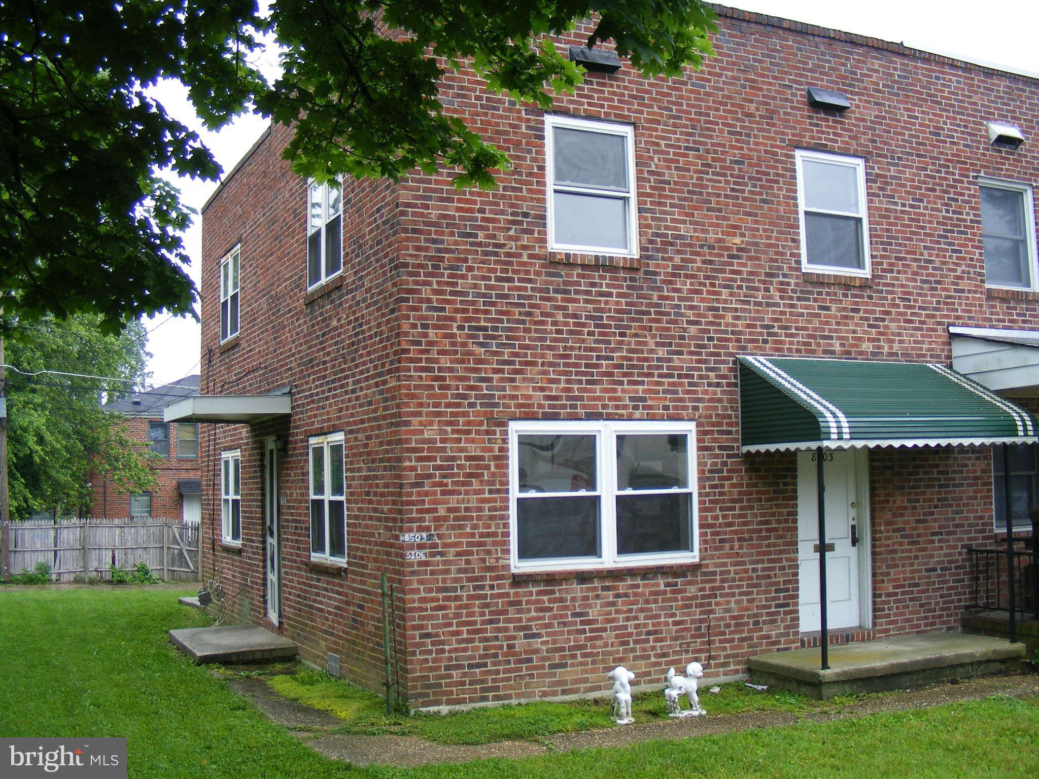8503 Chestnut Oak Road Baltimore, MD 21234 - Photo 2 of 13 a front view of a house with a yard and garage