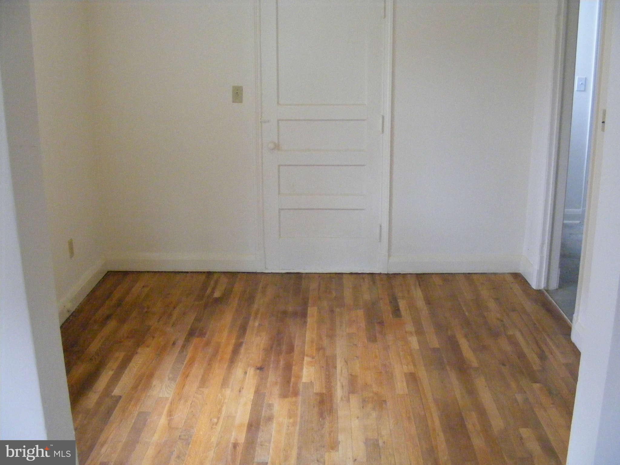 8503 Chestnut Oak Road Baltimore, MD 21234 - Photo 5 of 13 a view of empty room with wooden floor