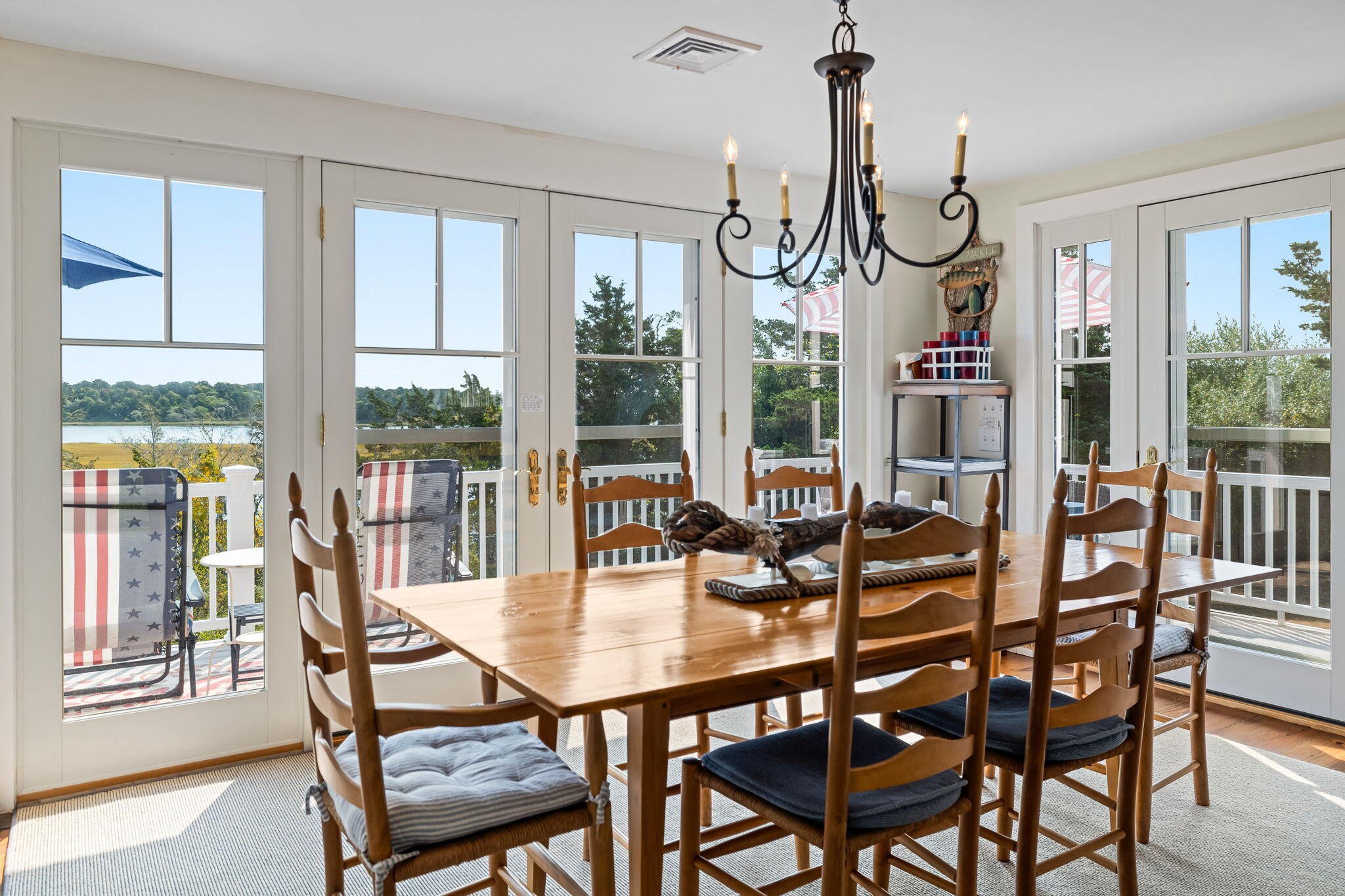 63 Briar Spring Road Orleans, MA 02653 - Photo 13 of 37 a view of a dining room with furniture window and outside view