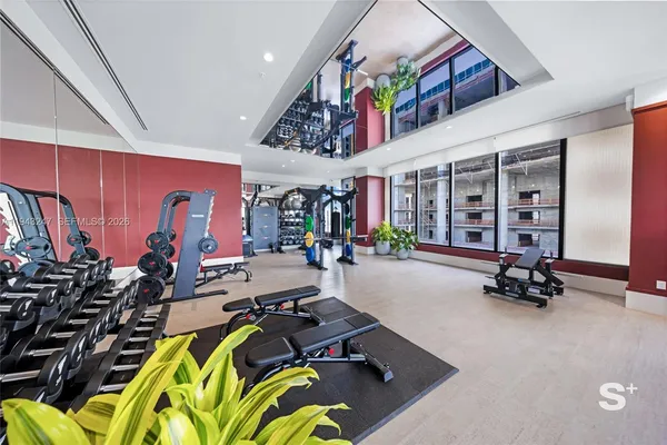 a very nice looking room with gym equipment