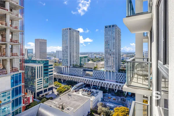 a view of a balcony with city view