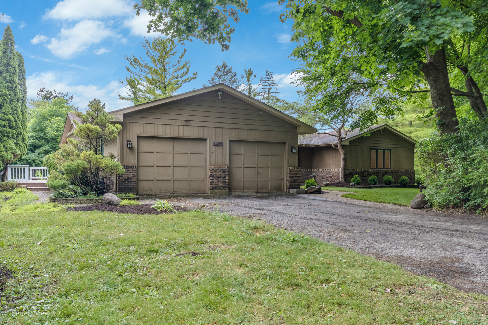 223 Brookbridge Road Trout Valley, IL 60013 - Photo 2 of 33 a front view of a house with a garden and yard