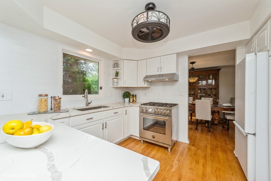 223 Brookbridge Road Trout Valley, IL 60013 - Photo 11 of 33 a kitchen with a stove appliances and wooden floor