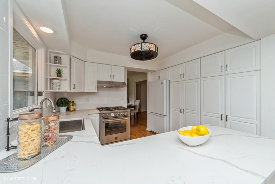 223 Brookbridge Road Trout Valley, IL 60013 - Photo 12 of 33 a view of a kitchen with a stove and cabinets