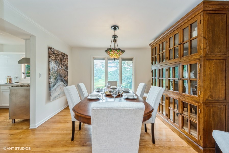 223 Brookbridge Road Trout Valley, IL 60013 - Photo 14 of 33 a dining room with furniture a chandelier and wooden floor