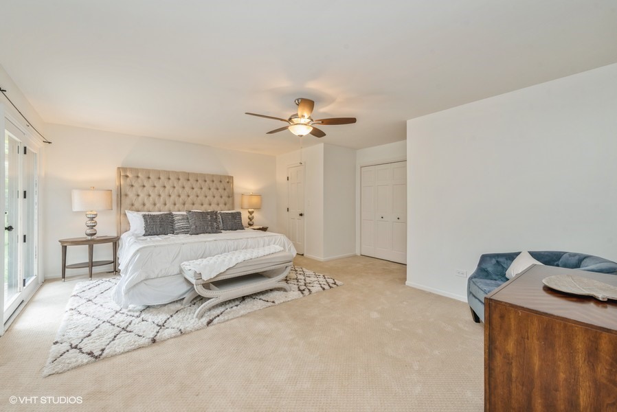 223 Brookbridge Road Trout Valley, IL 60013 - Photo 16 of 33 a bedroom with a bed and a chandelier