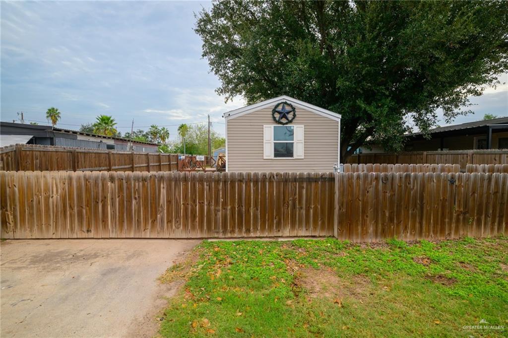 818 South 13th Street Alamo, TX 78516 - Photo 20 of 24 a front view of a house with a garden