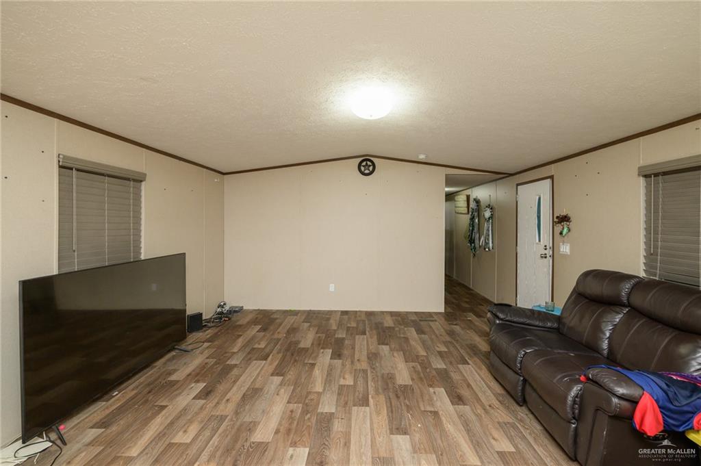 818 South 13th Street Alamo, TX 78516 - Photo 2 of 24 a view of livingroom with furniture and wooden floor