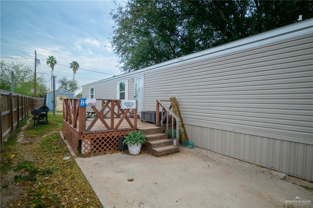 818 South 13th Street Alamo, TX 78516 - Photo 22 of 24 a backyard of a house with bicycles parked and trees