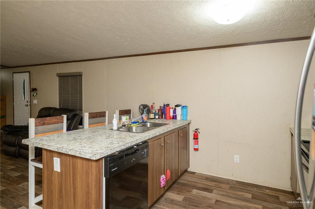 818 South 13th Street Alamo, TX 78516 - Photo 6 of 24 a utility room with a sink dryer and washer