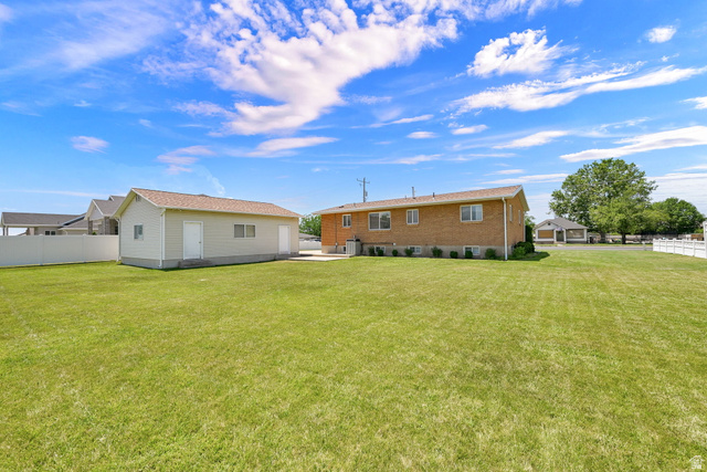 2467 South 2000 West Syracuse, UT 84075 - Photo 28 of 28 Expansive green lawn providing ample outdoor space