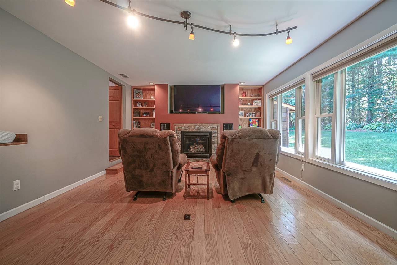 1052 South Harmony Road Oregon, IL 61061 - Photo 11 of 25 a living room with furniture and a flat screen tv