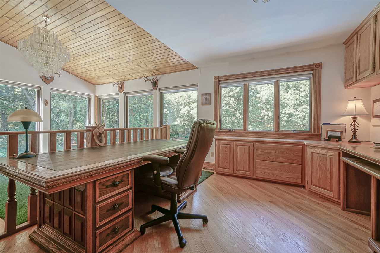 1052 South Harmony Road Oregon, IL 61061 - Photo 12 of 25 a dining room with a wooden table and chairs