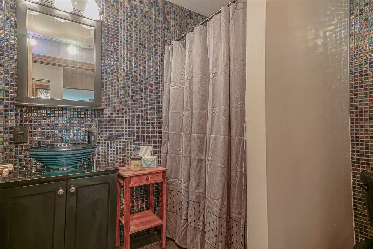 1052 South Harmony Road Oregon, IL 61061 - Photo 18 of 25 a bathroom with a sink and a mirror