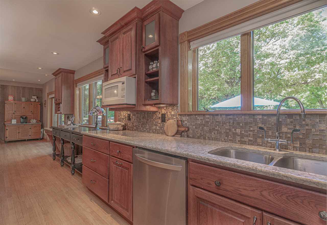 1052 South Harmony Road Oregon, IL 61061 - Photo 4 of 25 a kitchen with a sink and cabinets