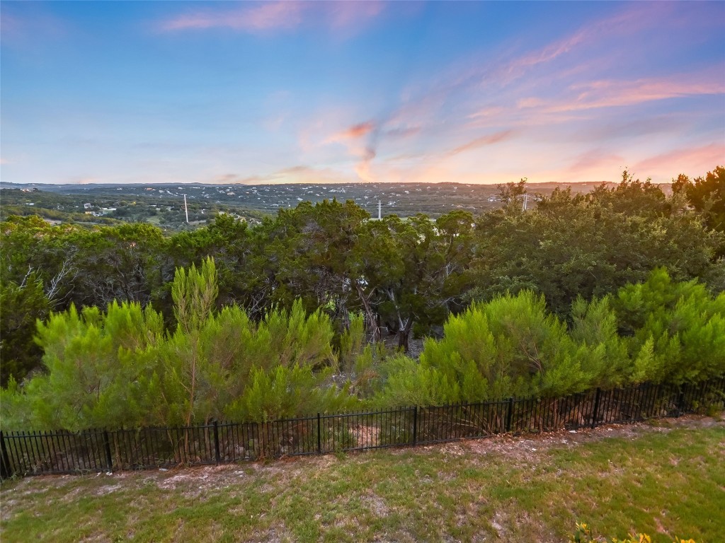 2610 Sunset Vista Circle, Unit 16 Spicewood, TX 78669 - Photo 20 of 28 View of yard at dusk