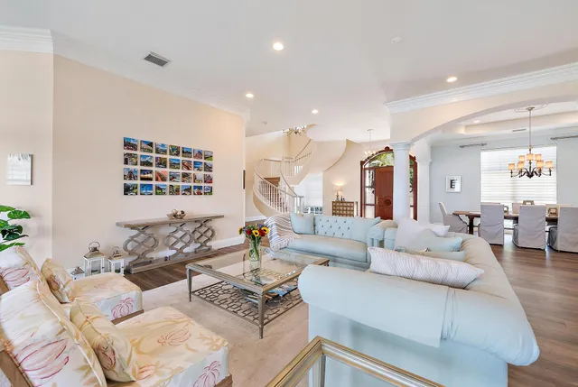 a living room with fireplace furniture and a wooden floor
