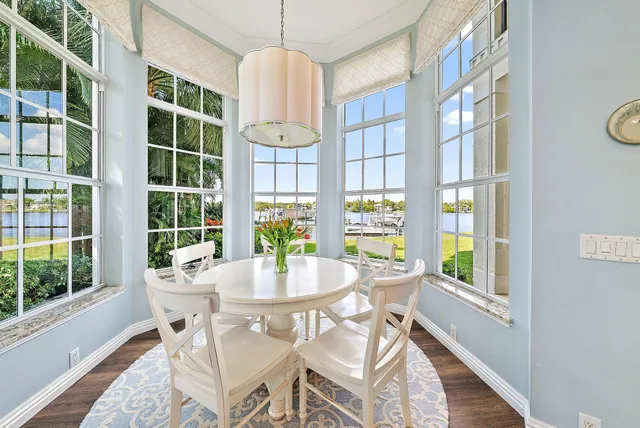 a bathroom with a granite countertop sink mirror vanity and toilet