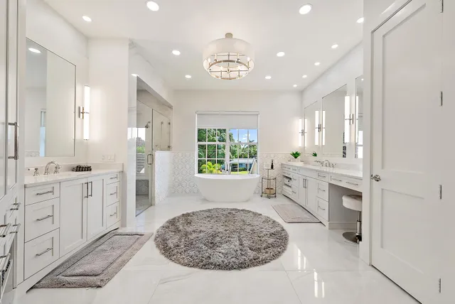 a view of a hallway with wooden floor windows and a living room