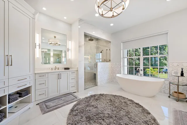 a living room with furniture floor to ceiling window and wooden floor