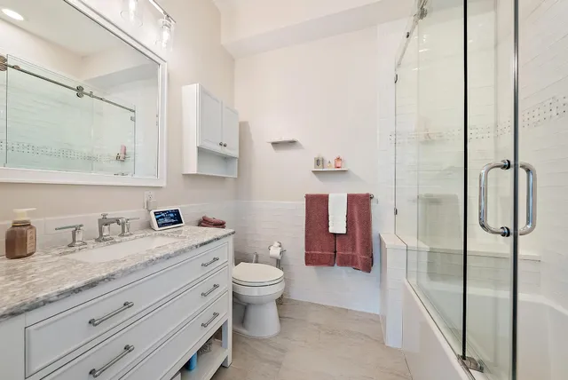 a view of a porch with furniture and garden