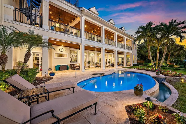 a living room with lots of furniture and a wooden floor