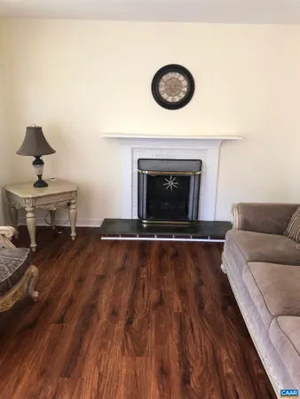 a living room with a couch and a fireplace