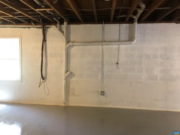 a view of a room with wooden walls