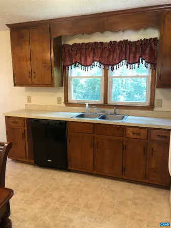 a kitchen with a sink and window