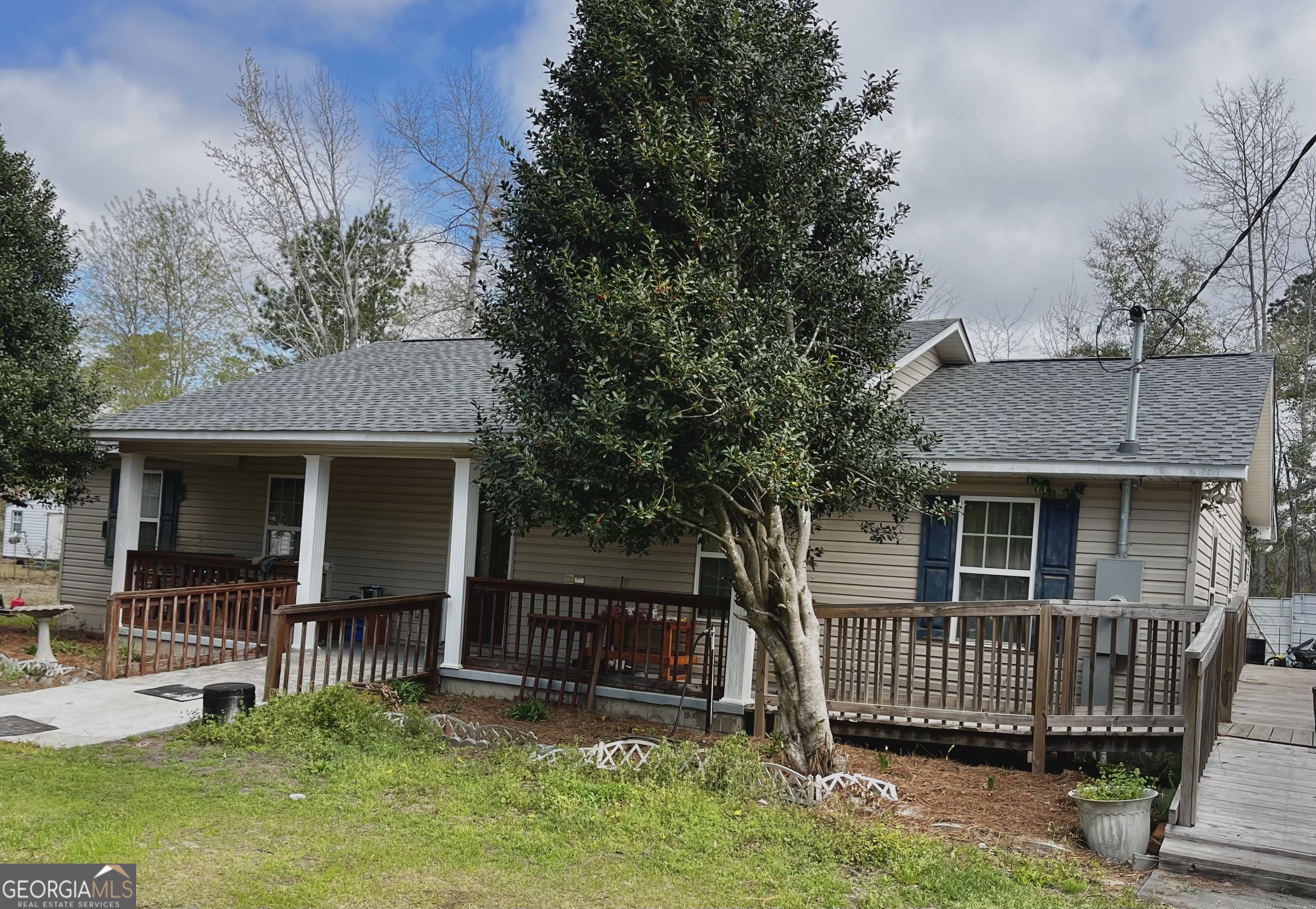 705 Geiger Street Mount Vernon, GA 30445 - Photo 1 of 11 a front view of a house with a garden