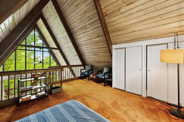 a view of an empty room and wooden floor