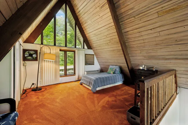 a bedroom with furniture and a window