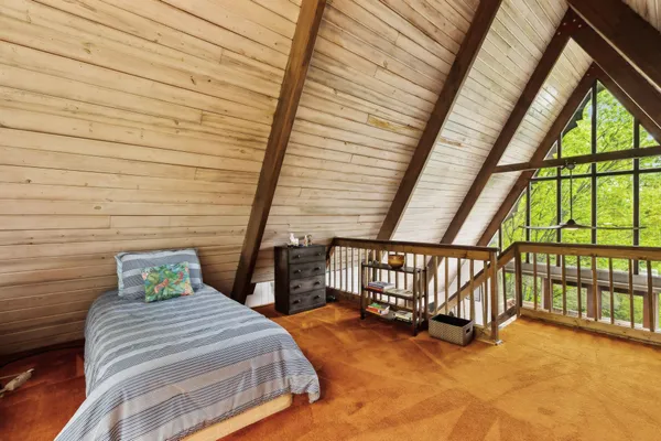 a living room with furniture and a floor to ceiling window