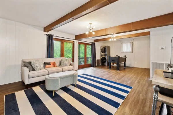 a living room with furniture and a flat screen tv