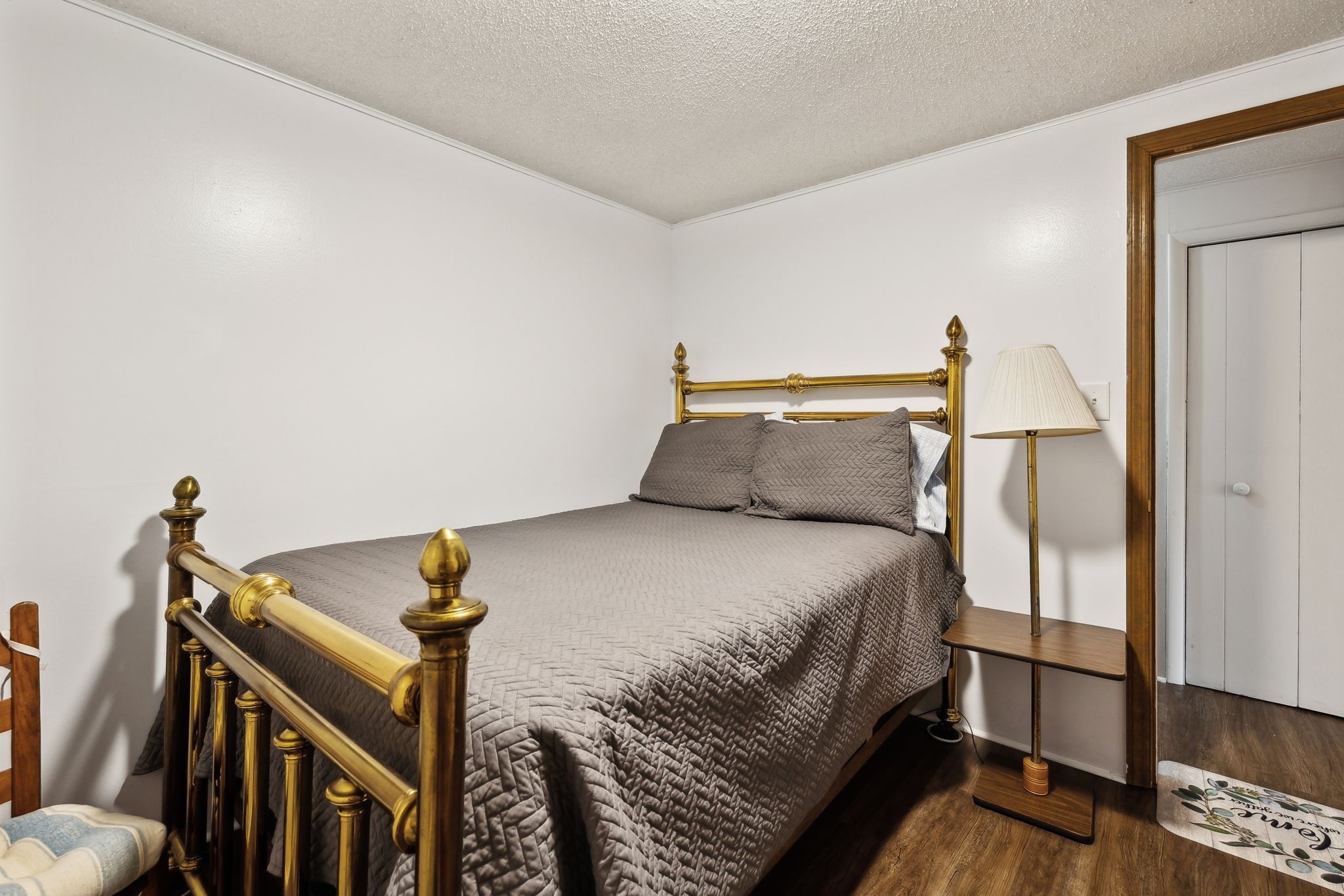 404 Duke Circle Lancaster, TN 38569 - Photo 28 of 43 a bedroom with a bed and wooden floor