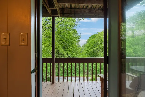 a view of a deck with a table and chairs and wooden floor