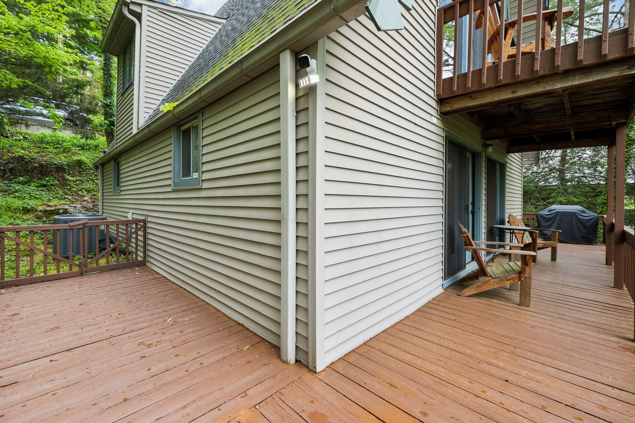 404 Duke Circle Lancaster, TN 38569 - Photo 34 of 43 a view of a deck with a table and chairs and wooden floor