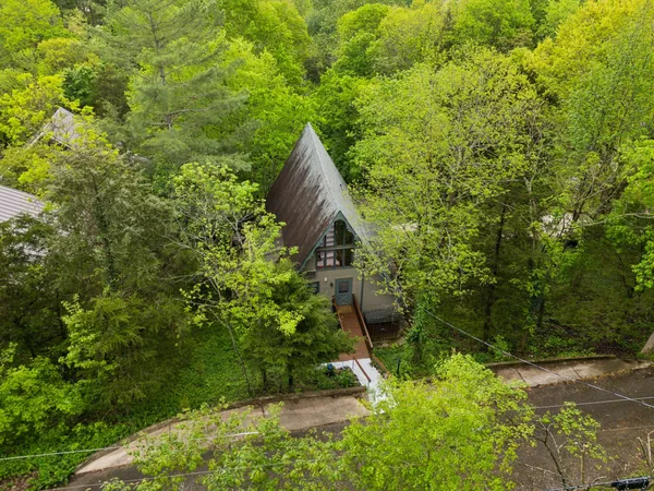 a view of house with a trees in the background
