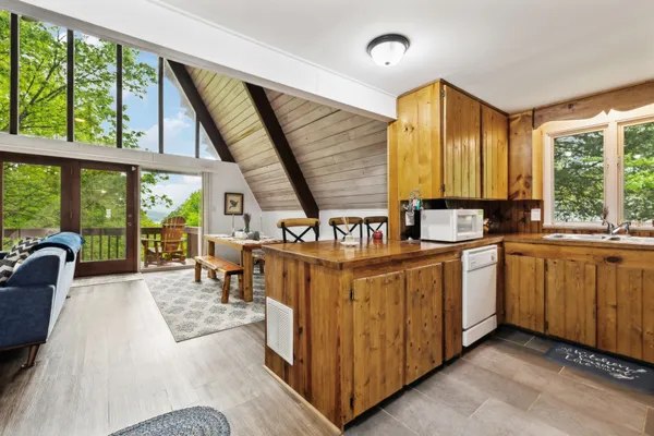 a very nice looking kitchen with a large window
