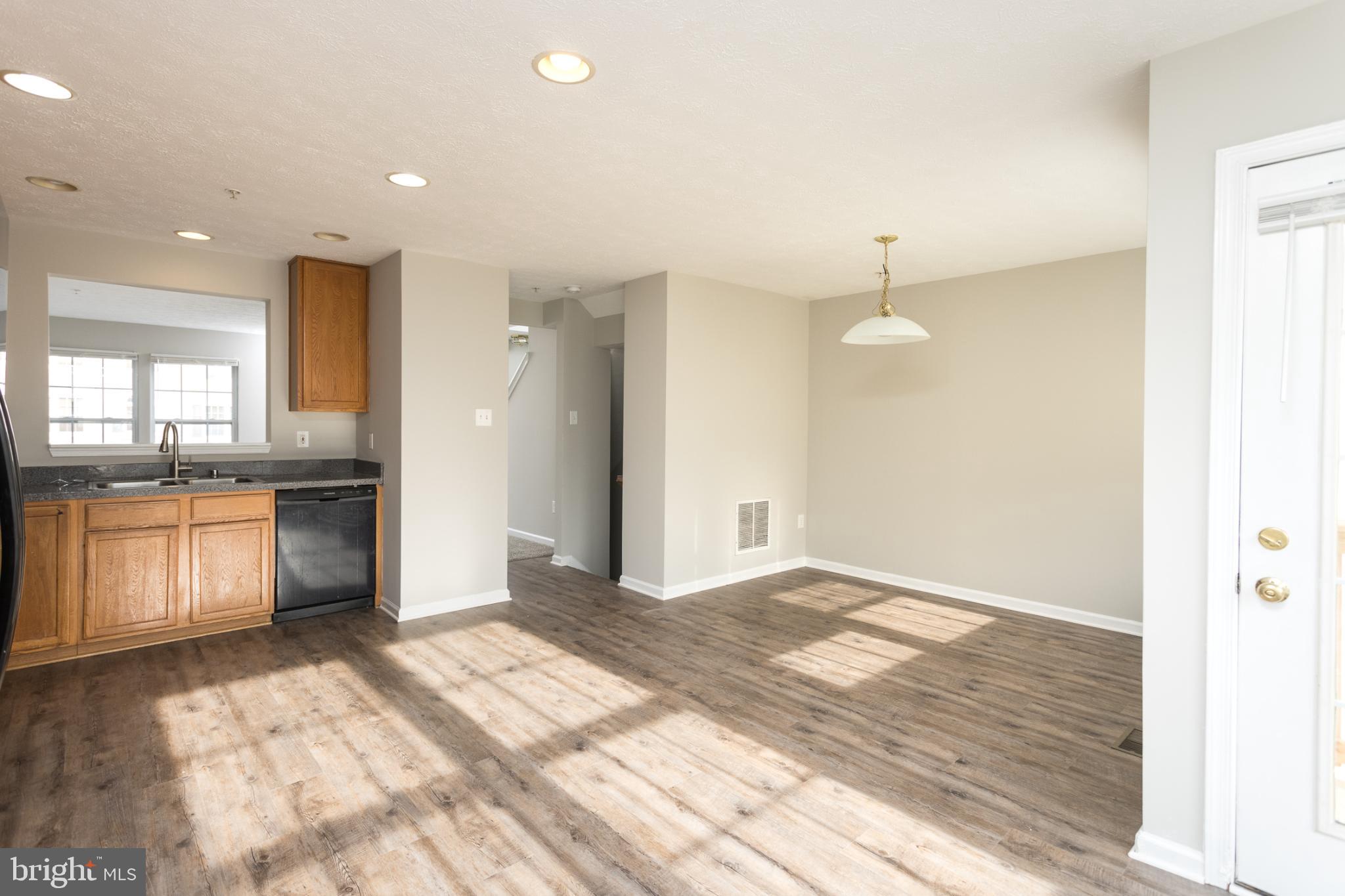 9899 Decatur Road Baltimore, MD 21220 - Photo 13 of 36 a view of a kitchen with a sink and a stove top oven