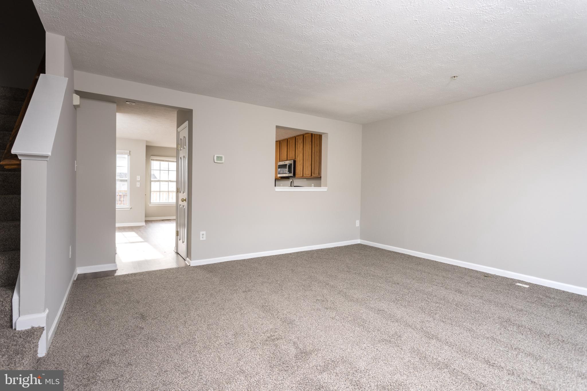 9899 Decatur Road Baltimore, MD 21220 - Photo 15 of 30 an empty room with windows and closet