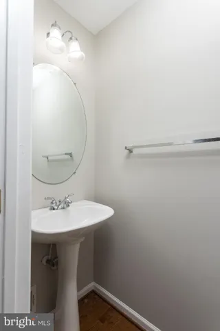 a bathroom with a sink and mirror