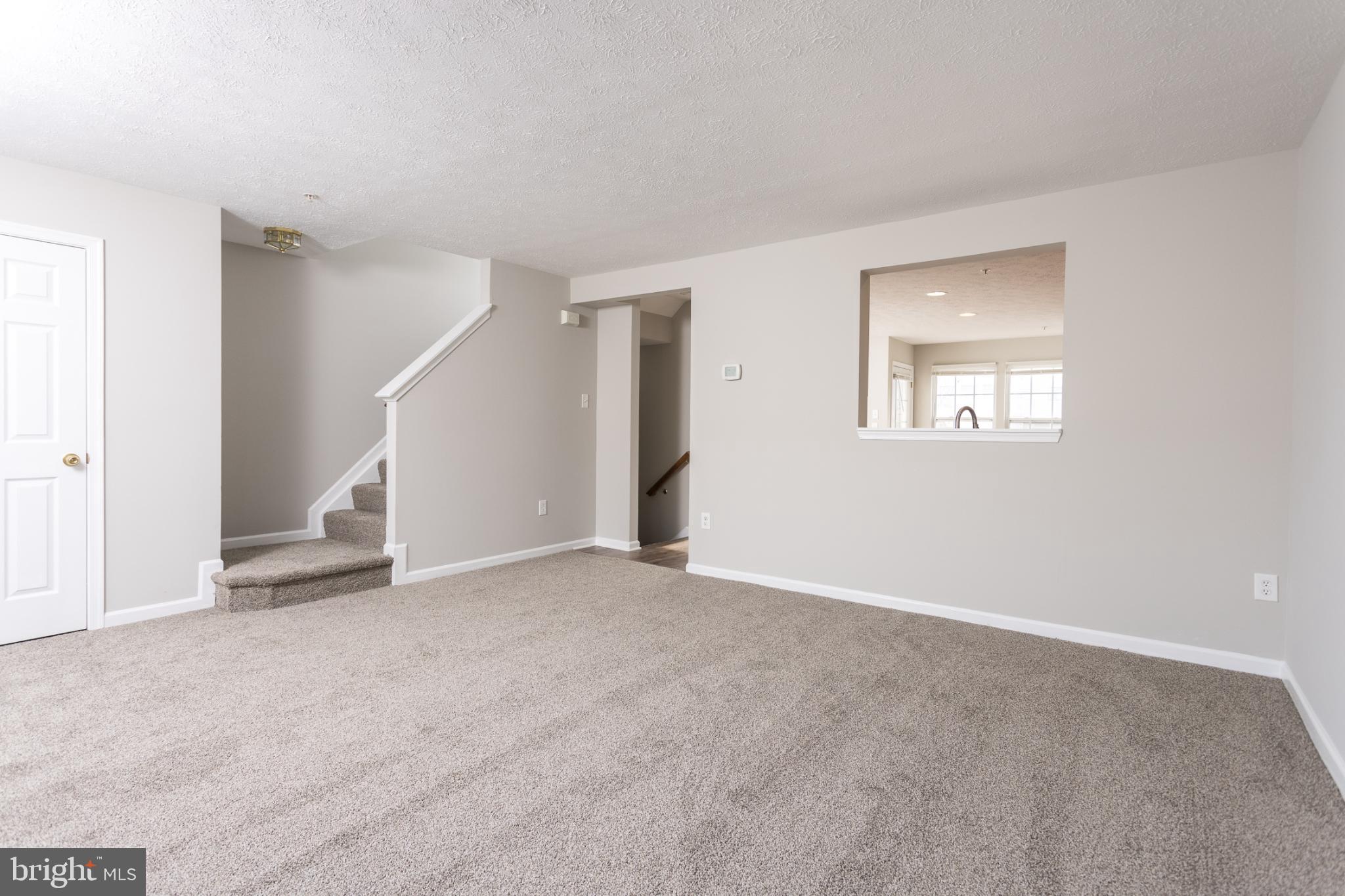 9899 Decatur Road Baltimore, MD 21220 - Photo 19 of 36 a view of an empty room with a window