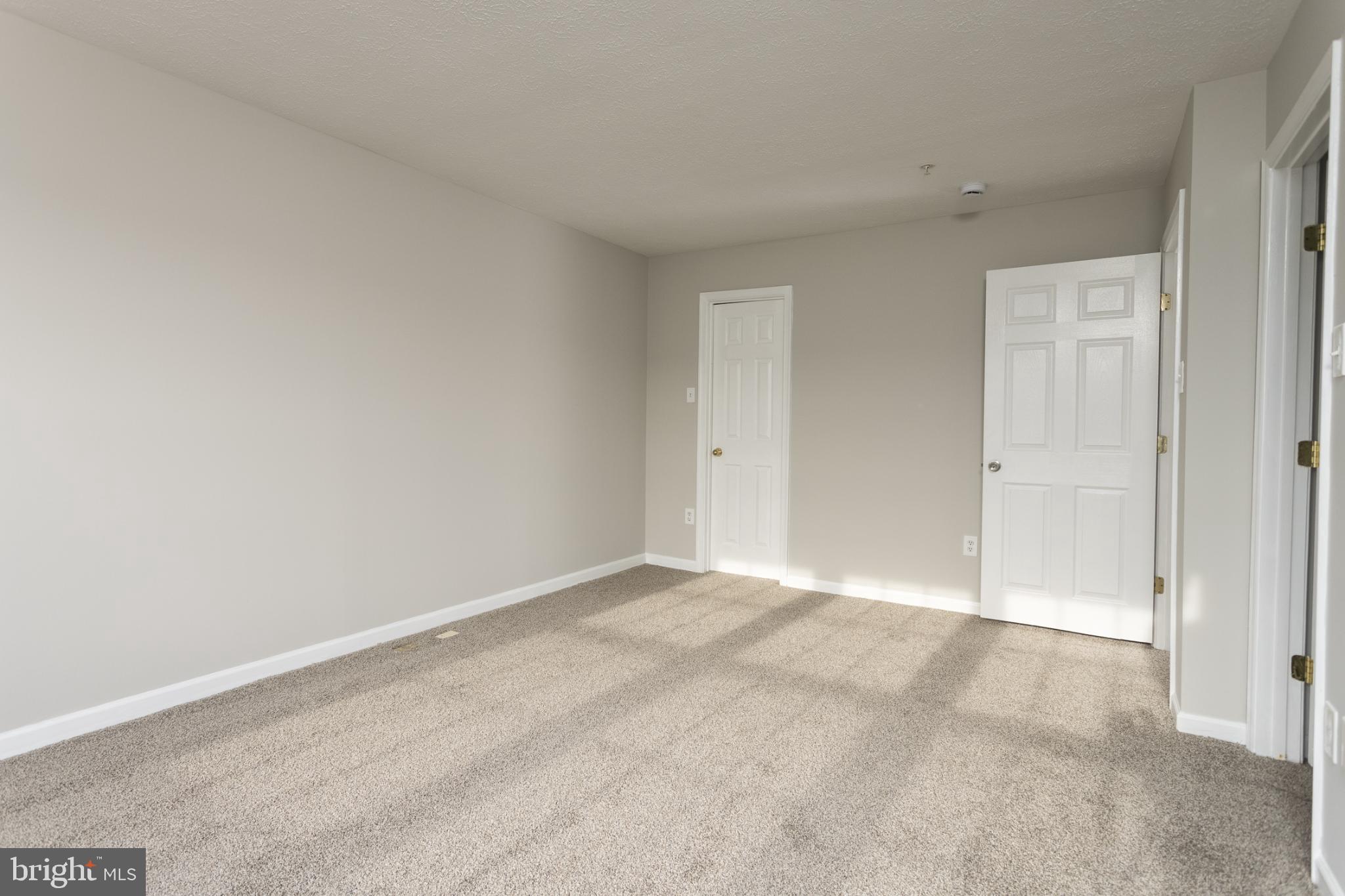 9899 Decatur Road Baltimore, MD 21220 - Photo 19 of 30 an empty room with an entryway