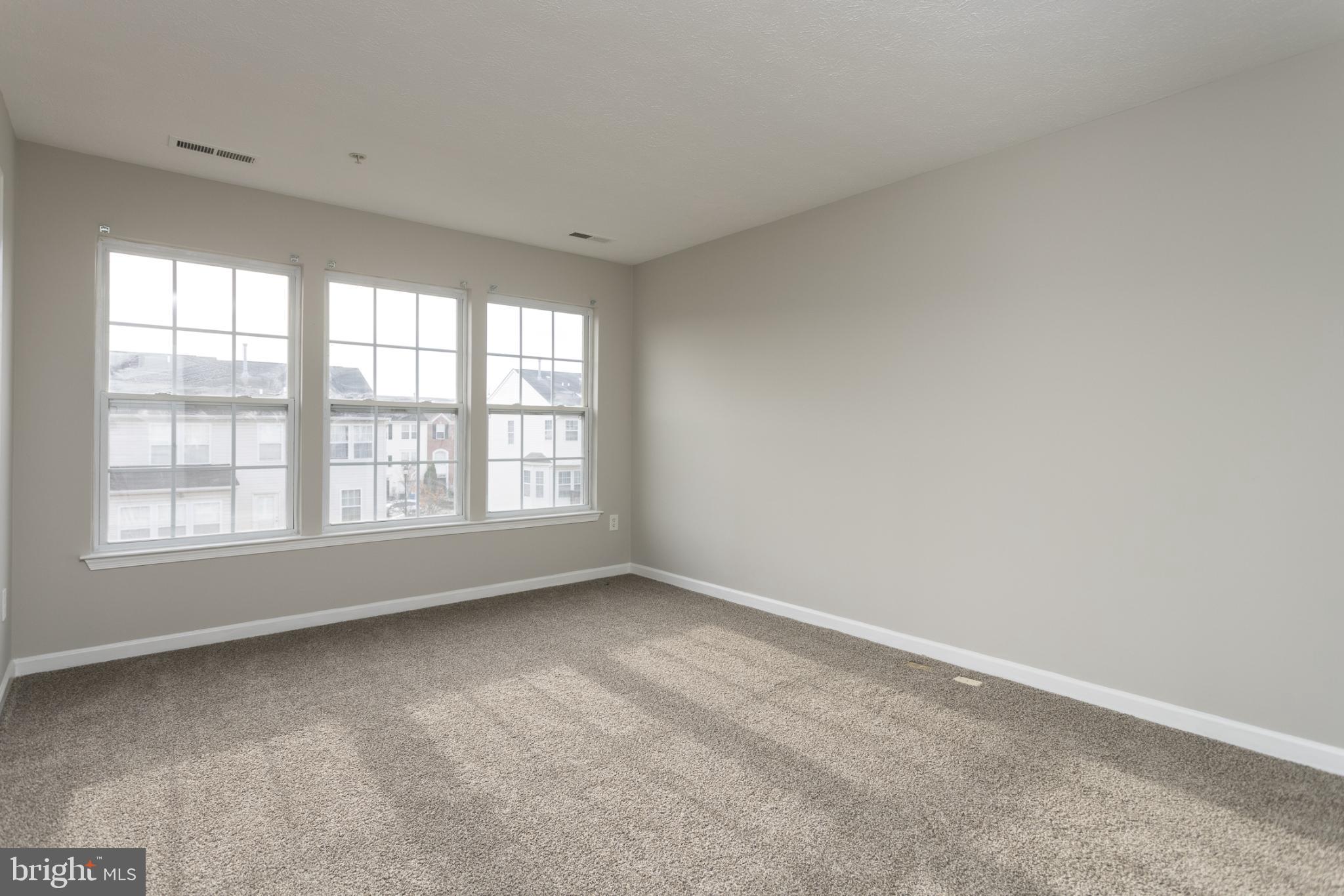 9899 Decatur Road Baltimore, MD 21220 - Photo 22 of 36 an empty room with a window