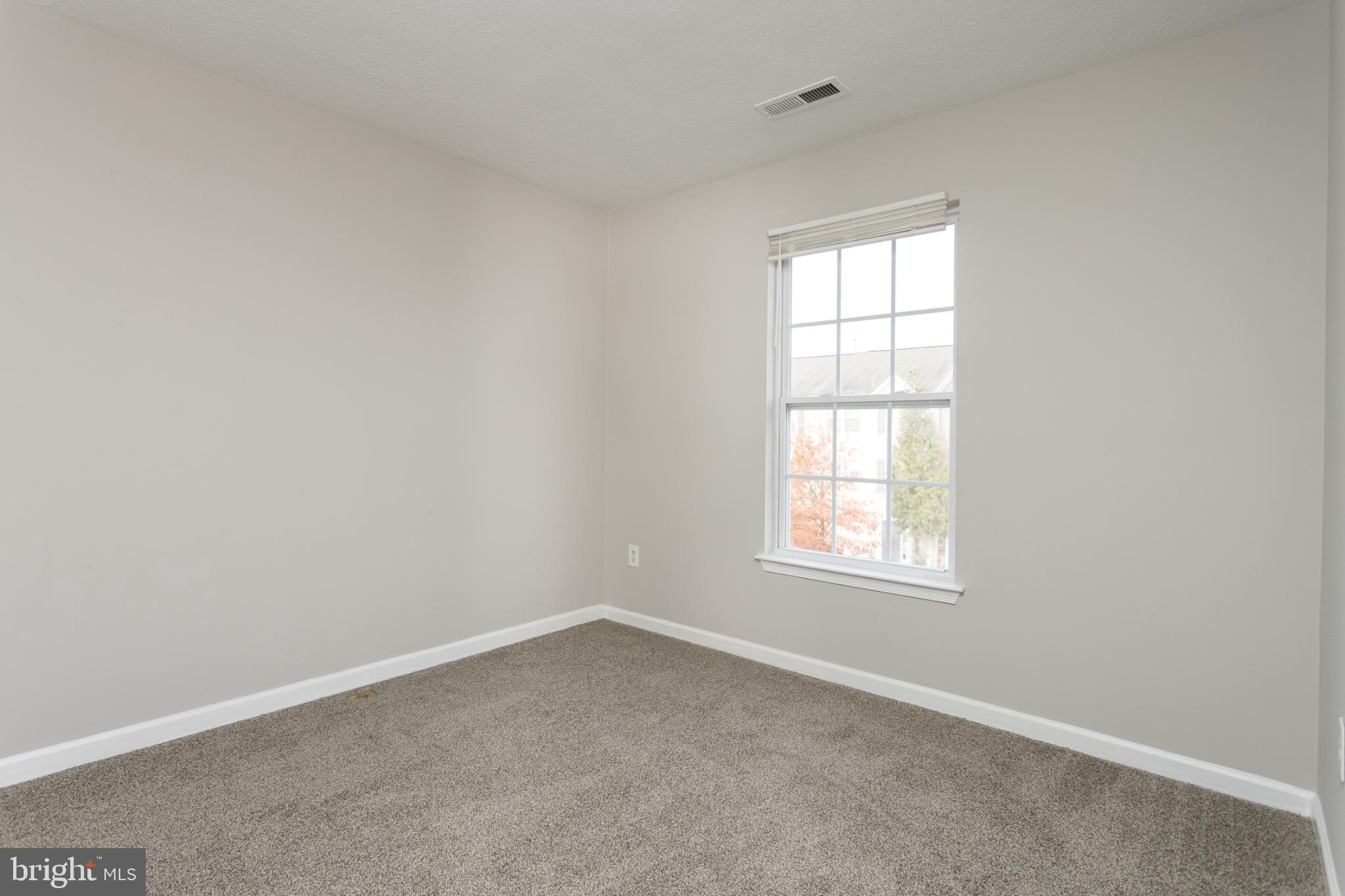 9899 Decatur Road Baltimore, MD 21220 - Photo 23 of 30 an empty room with a window
