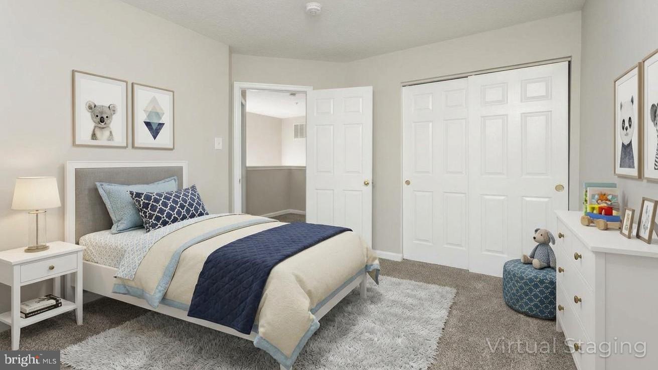 9899 Decatur Road Baltimore, MD 21220 - Photo 27 of 36 a bedroom with a bed and a window