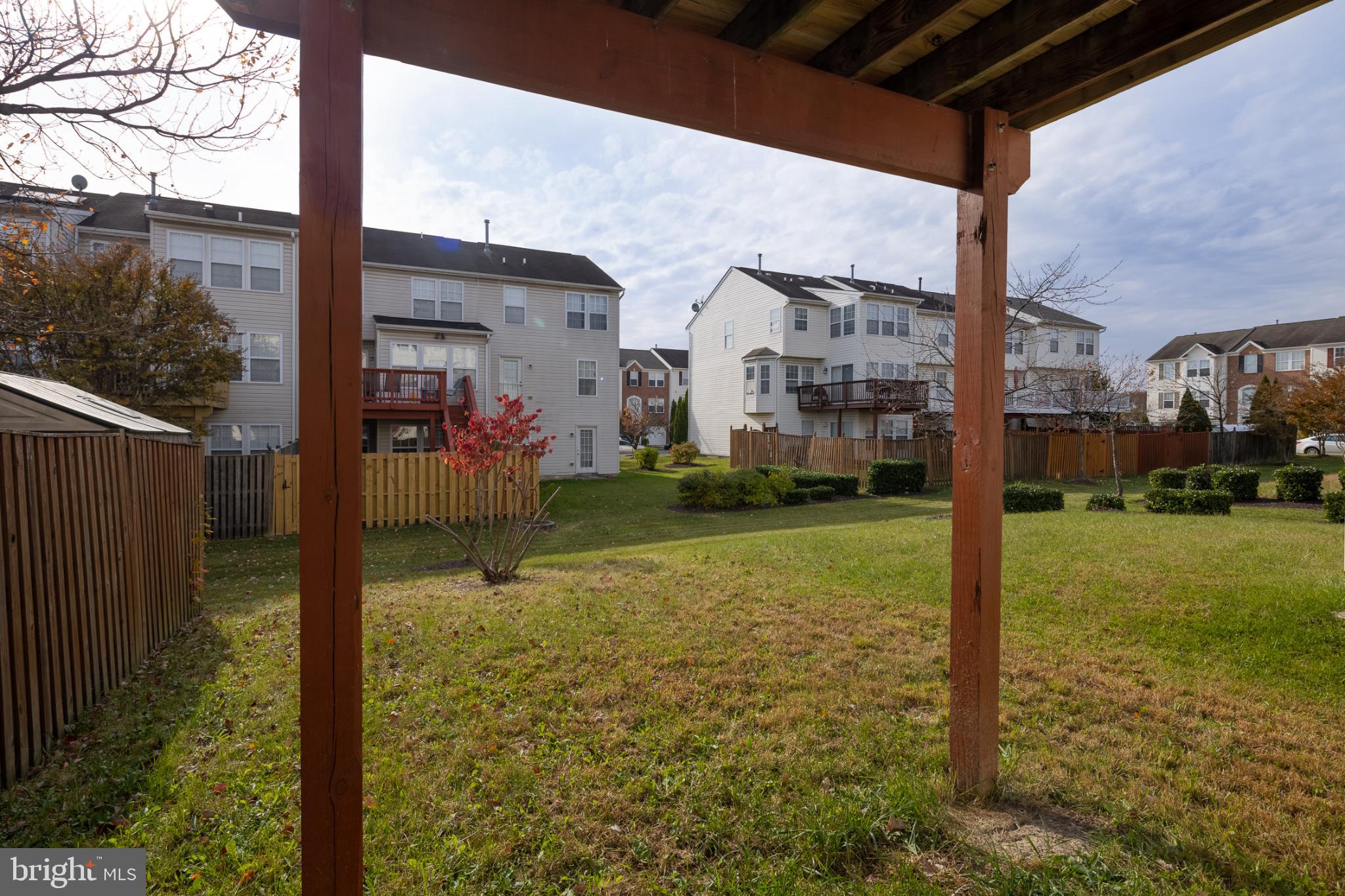 9899 Decatur Road Baltimore, MD 21220 - Photo 36 of 36 a view of a porch with a small yard and wooden fence