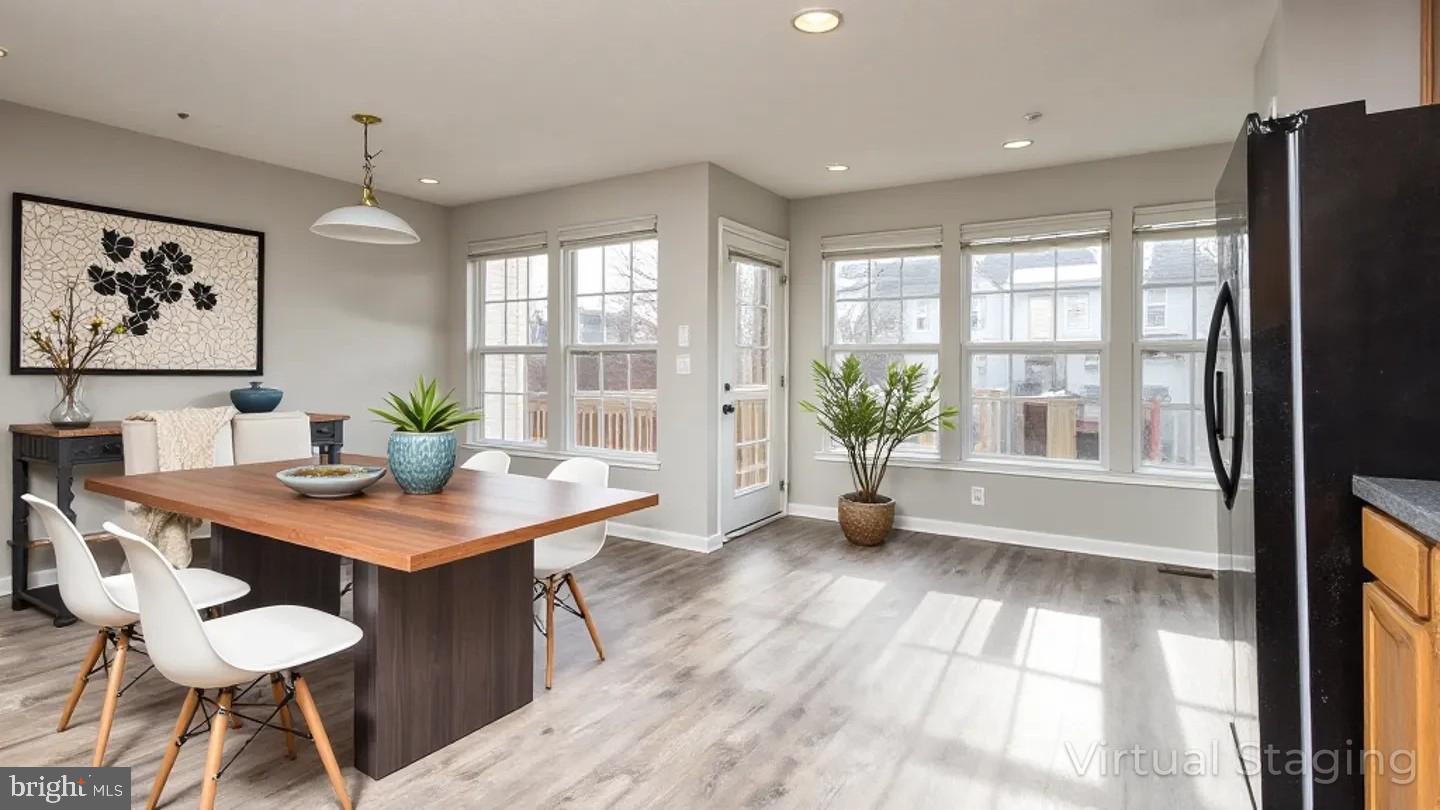 9899 Decatur Road Baltimore, MD 21220 - Photo 10 of 36 a view of a dining room with furniture window and wooden floor