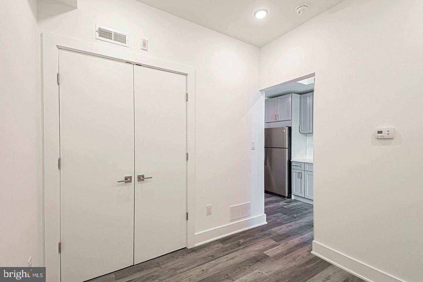 1245 Ridge Avenue, Unit 103 Philadelphia, PA 19123 - Photo 9 of 18 a view of a hallway with wooden floor